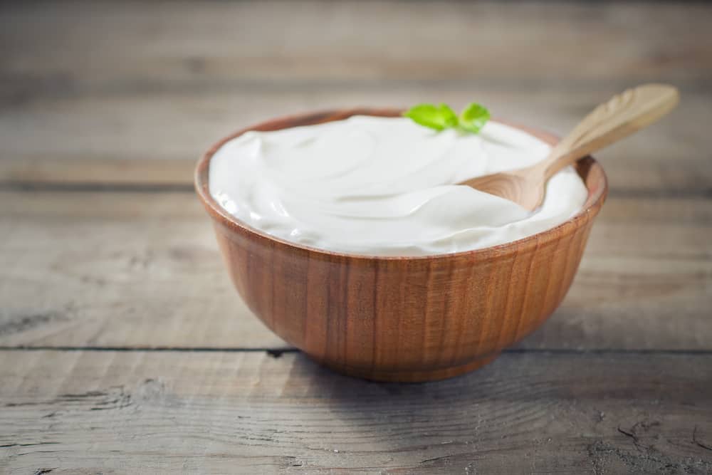 Greek,yogurt,in,a,wooden,bowl,on,a,rustic,wooden