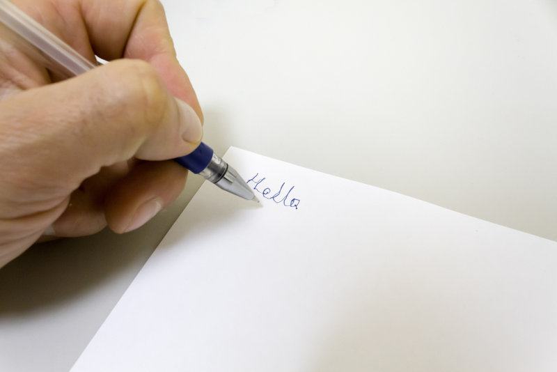 The,right Hander,writes,the,words,"hello",with,his,left,hand.