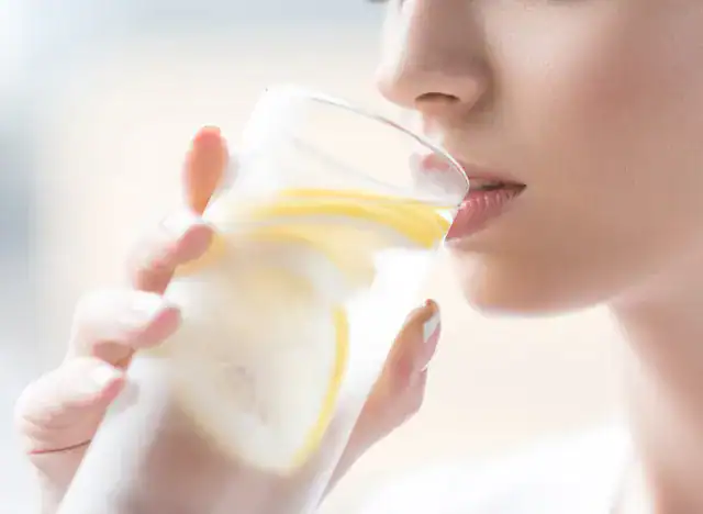 Woman Drinking Lemon Water